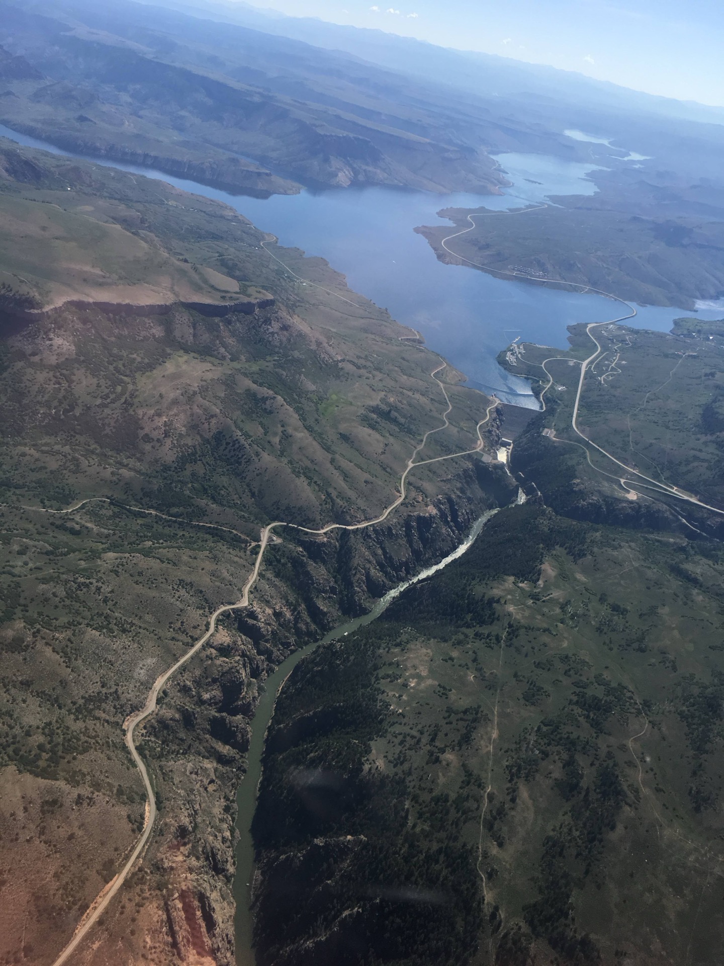 Aerial view of a winding river and canyon landscape / 从空中看到蜿蜒河谷景色