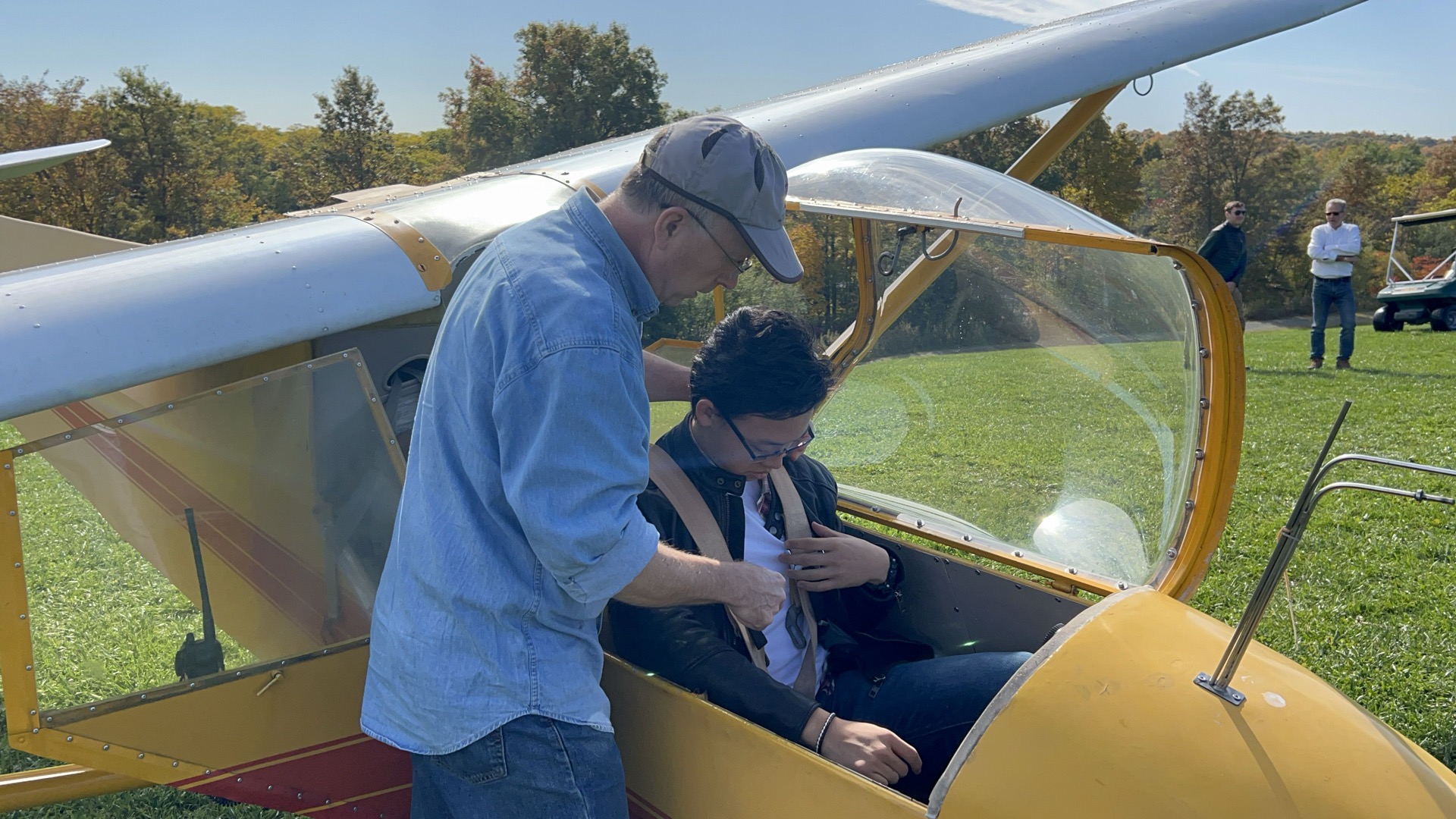 A small aircraft parked on the runway ready for flight