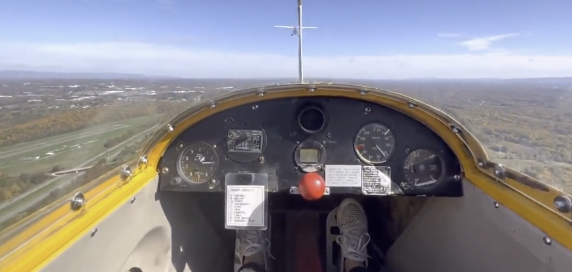 Aerial scenery with fields and horizon visible below